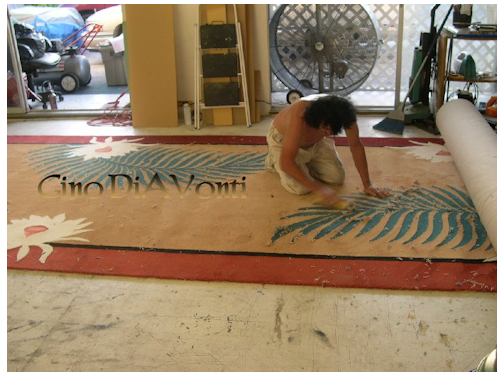 As you can see, this is a very big Custom Designed Rug. Notice that much of it is still rolled up